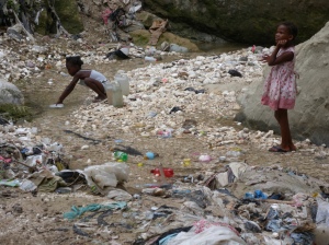 Collecting-contaminated-water-in-Haiti